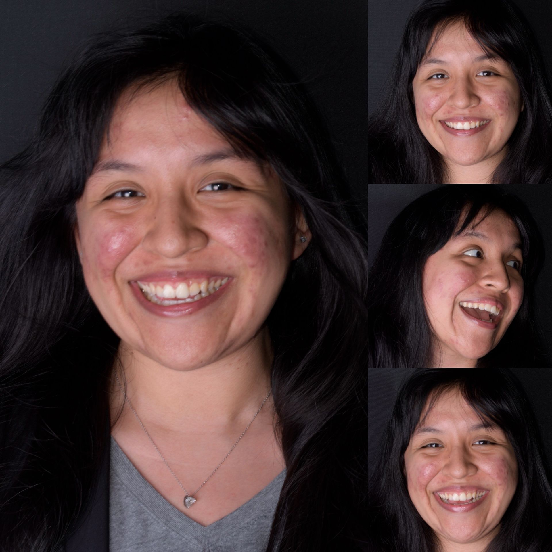 A woman in a blue shirt is smiling and covering her eyes with her hands.