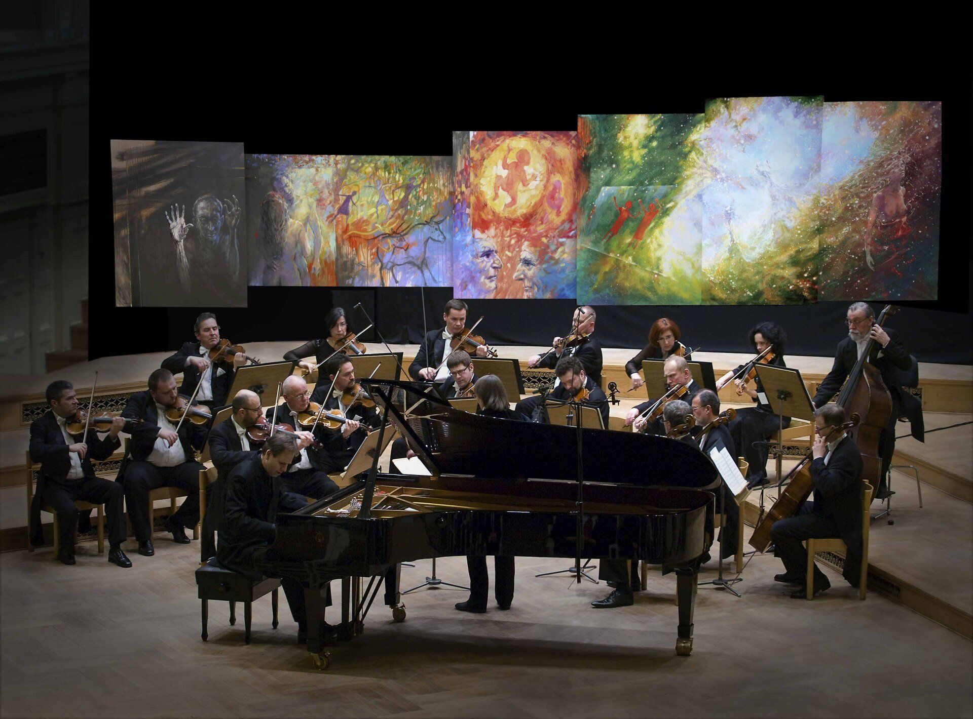 Amadeus Orchestra of Polish Radio in front of Mariusz Kaldowski  painting to Mussorgsky's Pictures at an Exhibition