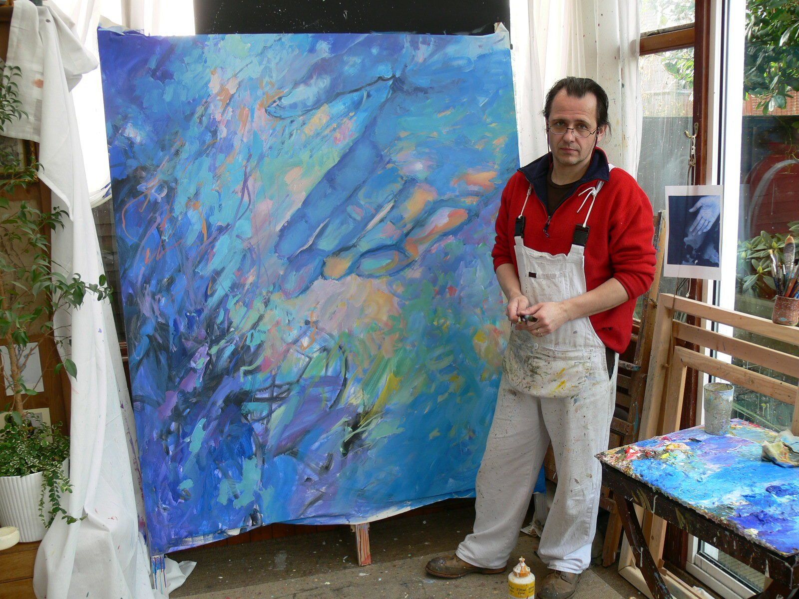 Mariusz Kaldowski in front of his painting to Astor Piazzolla's Spring tango music, part of his Four Seasons