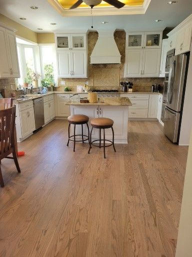 Wooden hardwood floor with warm, honey-toned planks.