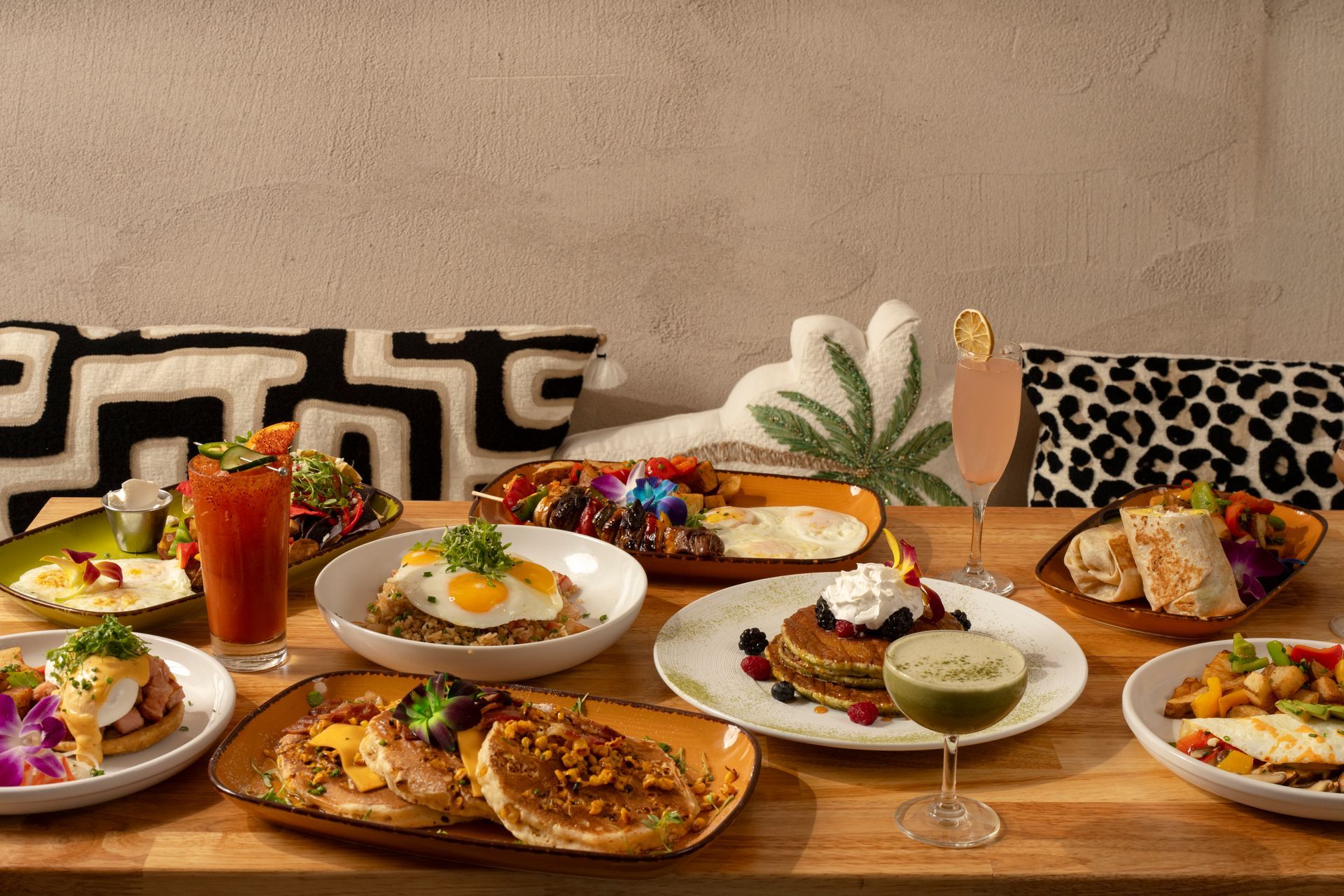 Covered patio lounge seating with fireplace on the corner of Kettner & Hawthorne in San Diego. 