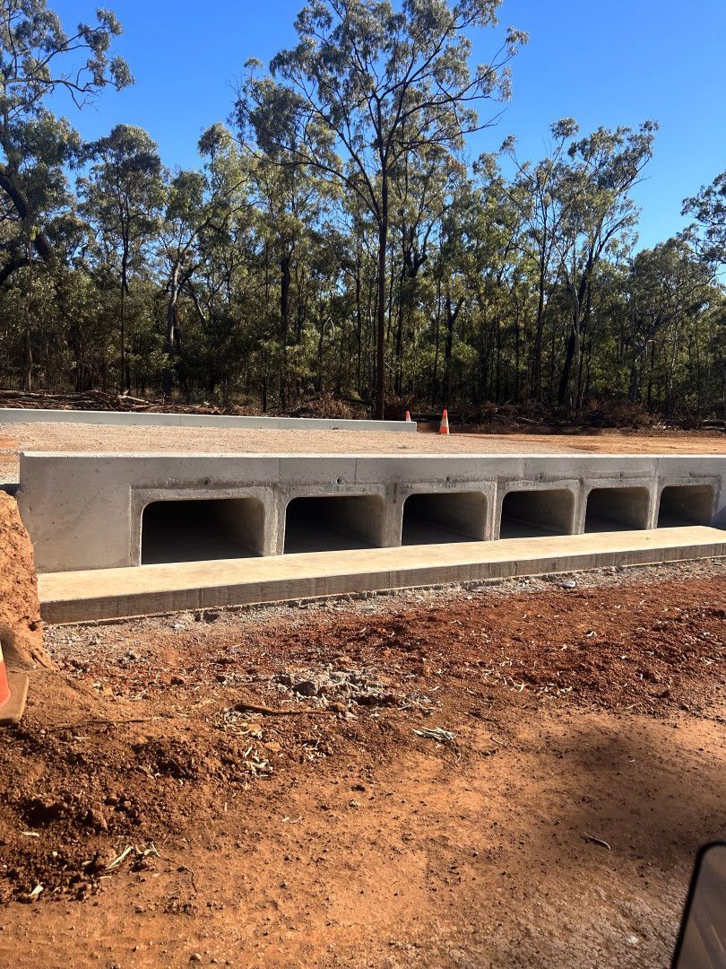 A Group of Construction Workers Are Working on A Construction Site at night 