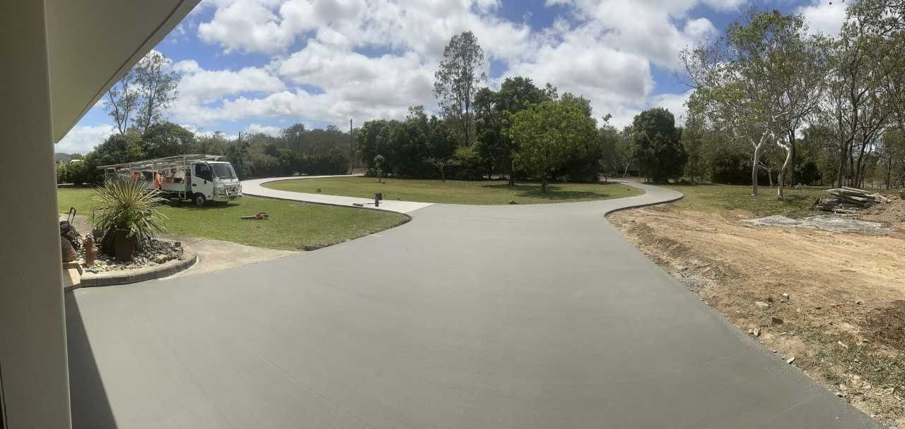 A Person Wearing An Orange Glove Is Plastering A Wall With A Trowel — Wieland Contracting In Tolga, QLD