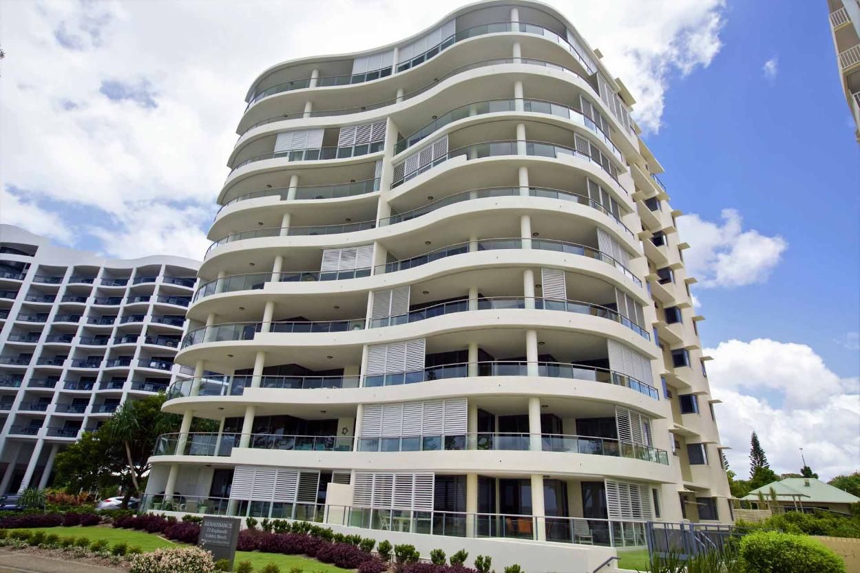 A Large White Building With A Lot Of Balconies On A Sunny Day — Balcony Shutters Australia In Moffat Beach, QLD