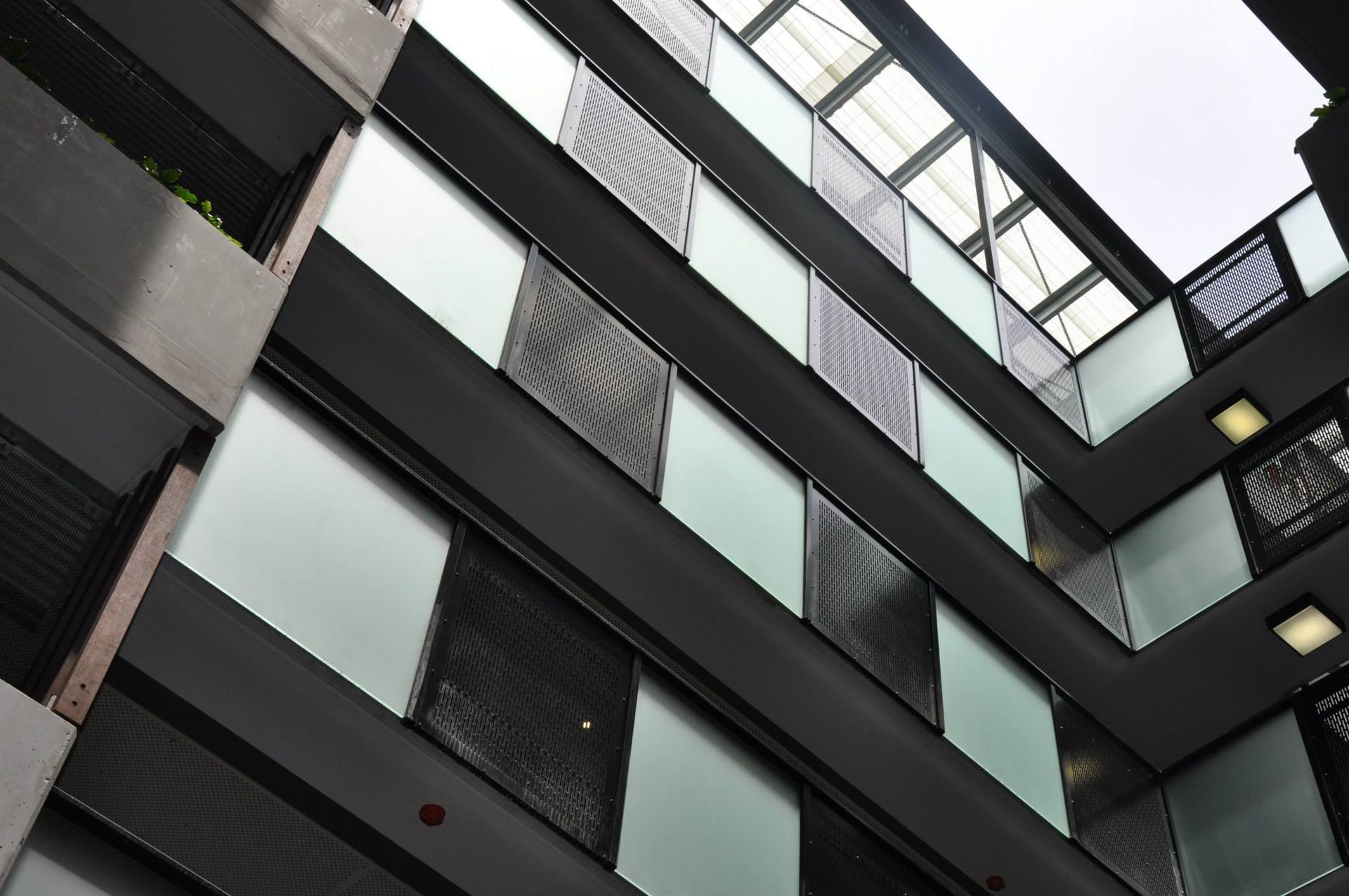 Interior Building Featuring Alternating Frosted and Screened Window Panels.