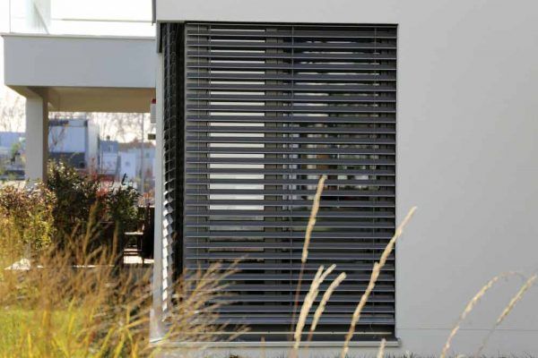 A House With A Window With A Blind On It — Balcony Shutters Australia In Moffat Beach, QLD