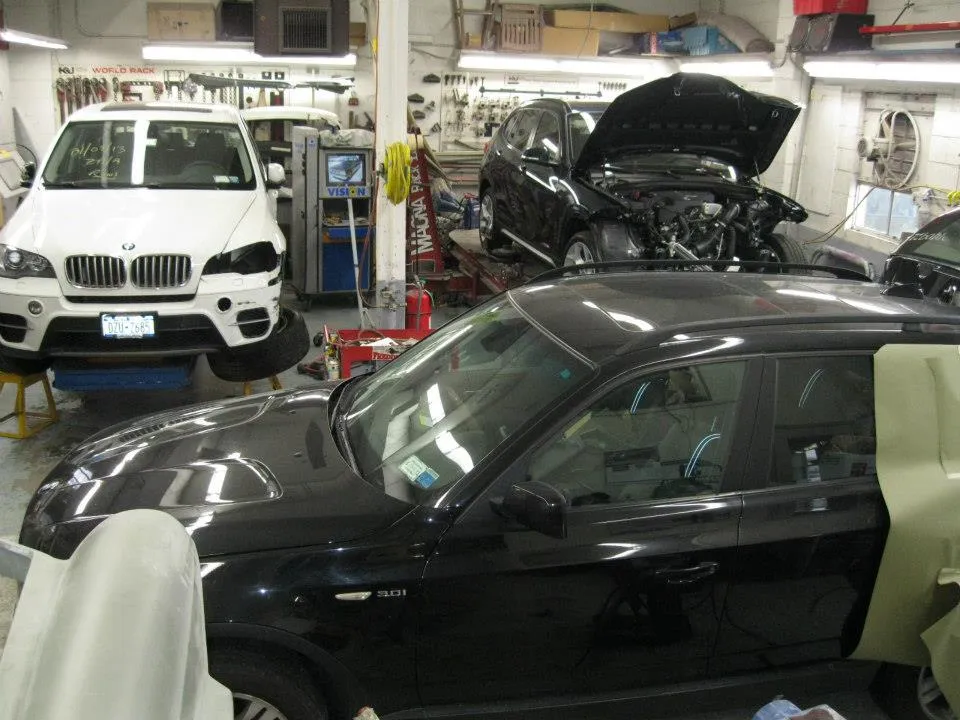 A car is being worked on in a garage