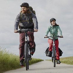 a couple riding a bicycle