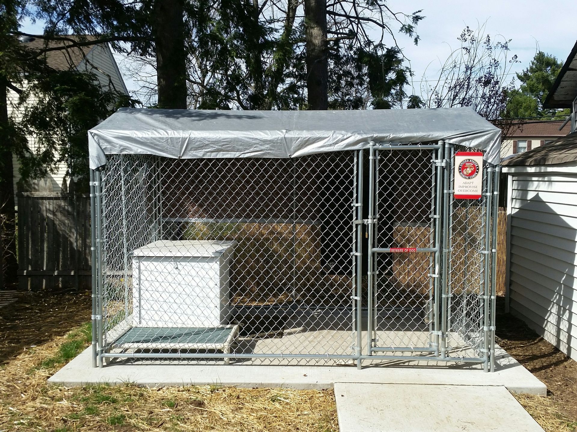 A chain link fence with a sign that says do not enter