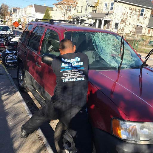 Man Removing Wind shield ─ Staten Island, NY ─ Angel's Auto Glass