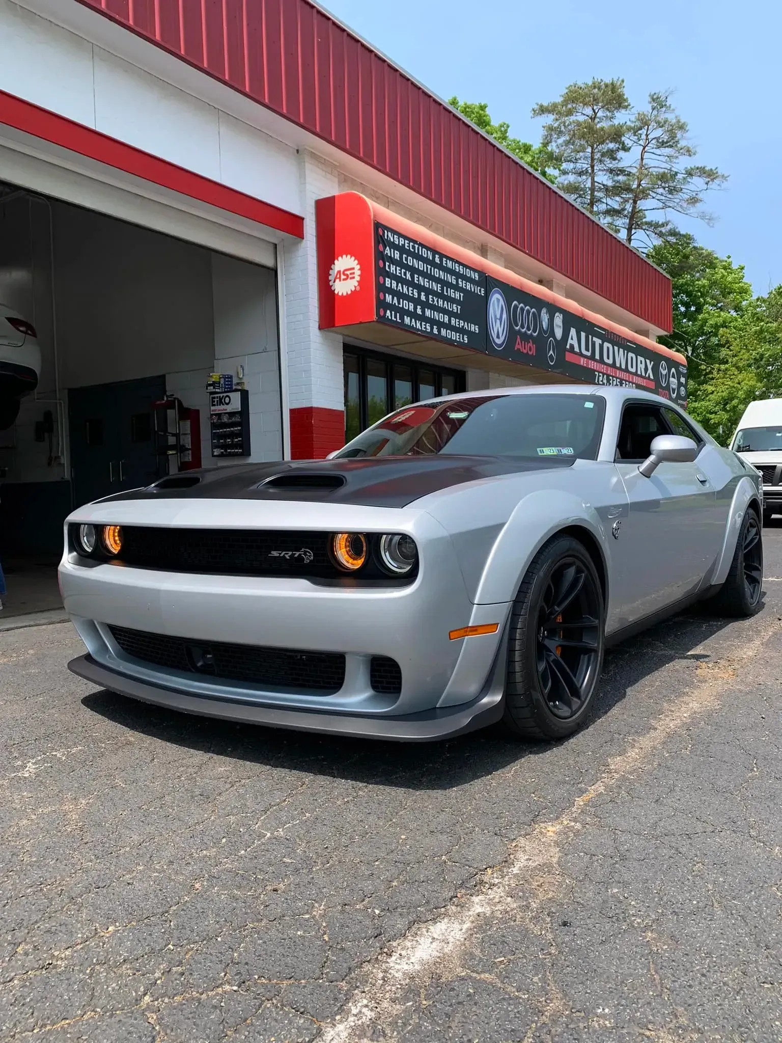 Silver Dodge Challenger Parked in Front of Shop | European Autoworx