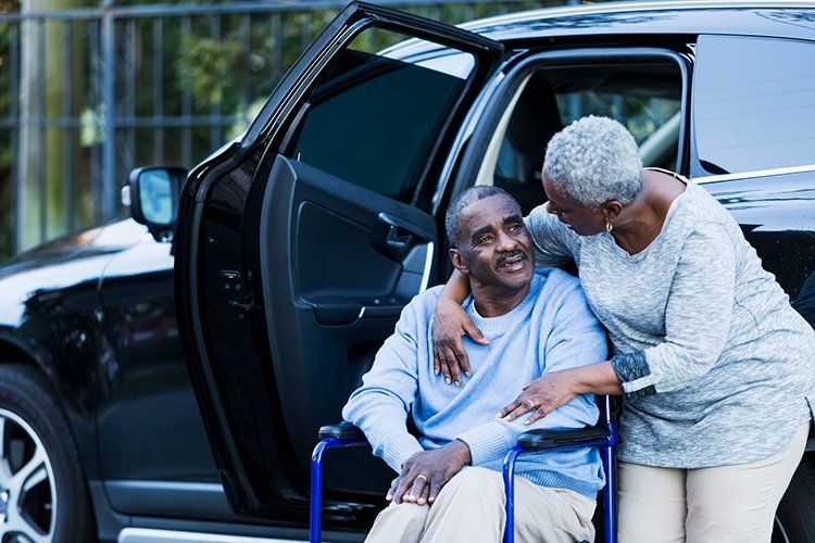 Woman Beside the Senior Man in Wheelchair — Wilmington, DE — Direct Mobile Transit Inc.