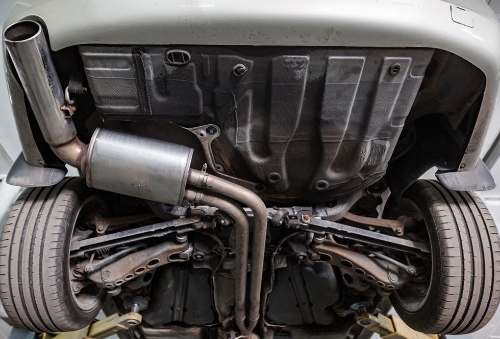 A Close Up Of The Underside Of A Car With A Exhaust Pipe — APPS Mechanical Port Macquarie In Port Macquarie, NSW
