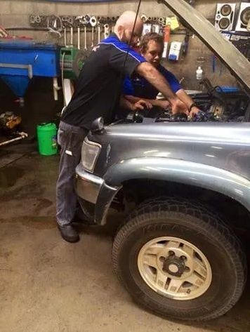 Two Mechanics Work Intently in a Garage — APPS Mechanical Port Macquarie In Port Macquarie, NSW