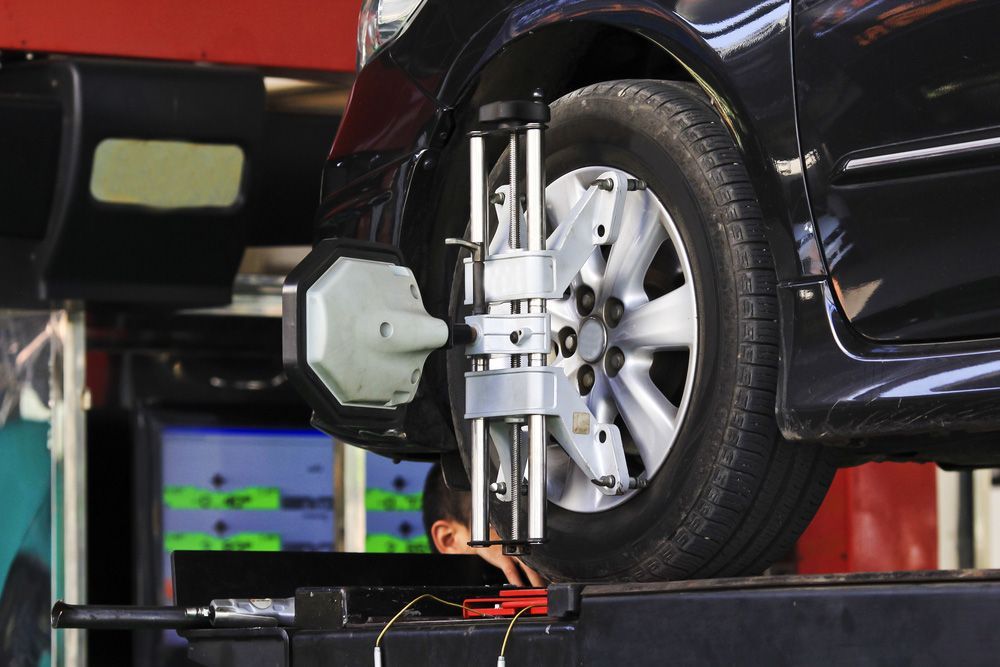 Wheel Alignment in Progress in A Mechanic Shop