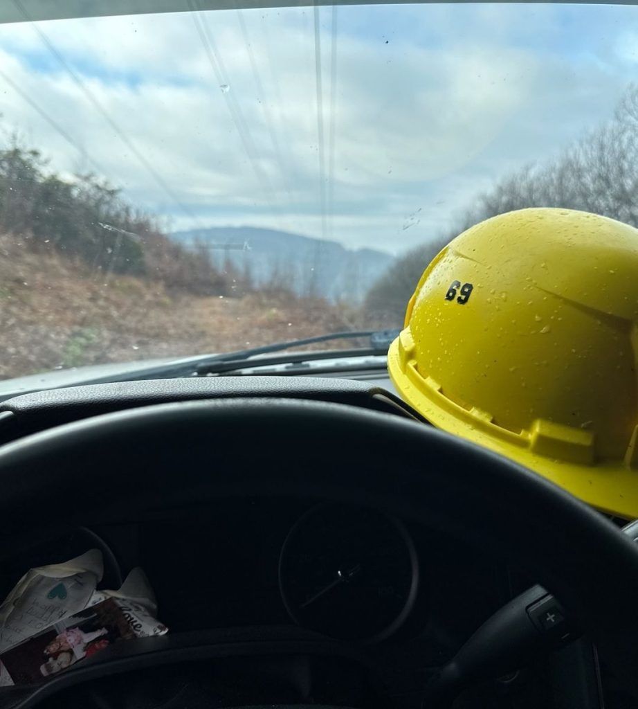 A yellow hard hat with the number 83 on it