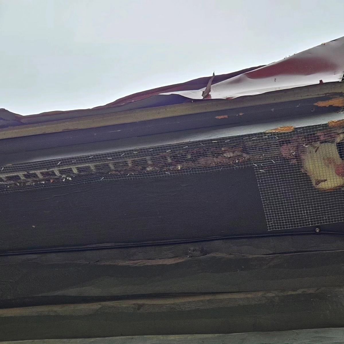 A close up of a roof with a hole in it.