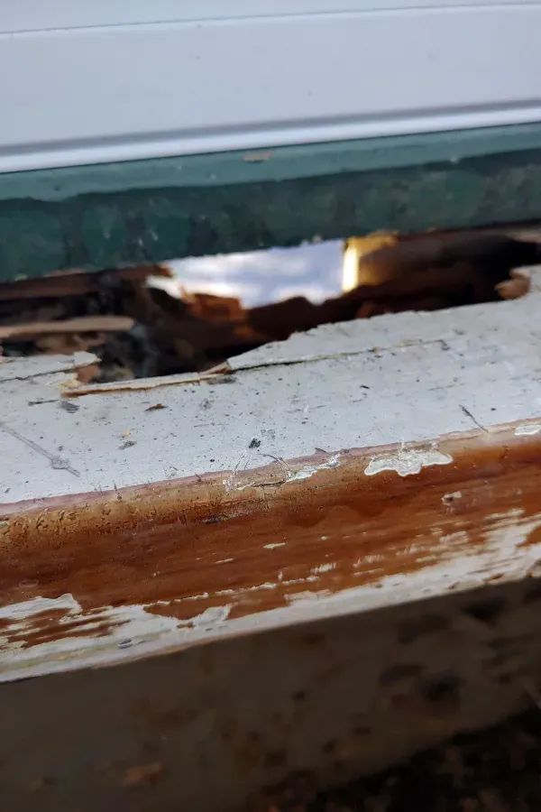 A close up of a piece of wood with a hole in it