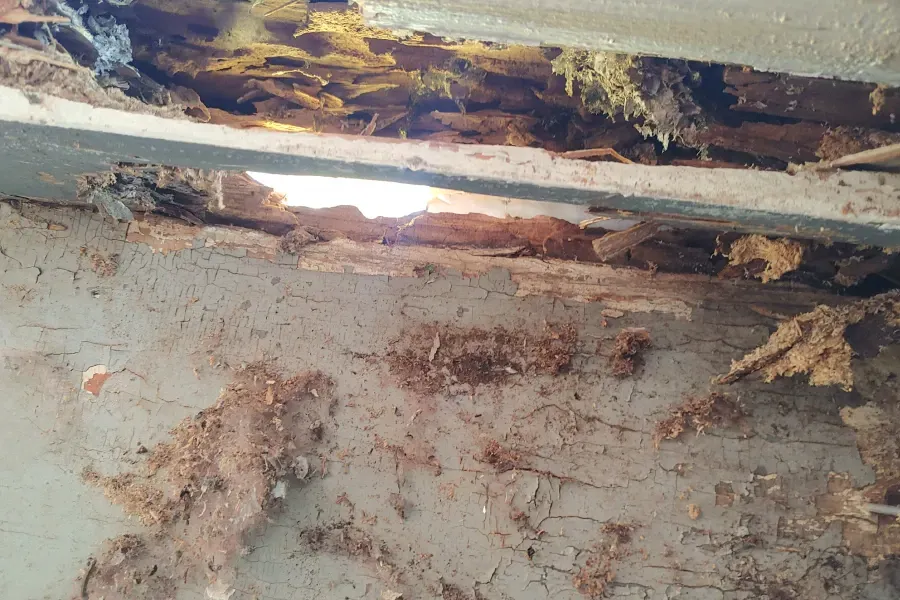 A hole in a wall with a light coming out of it.