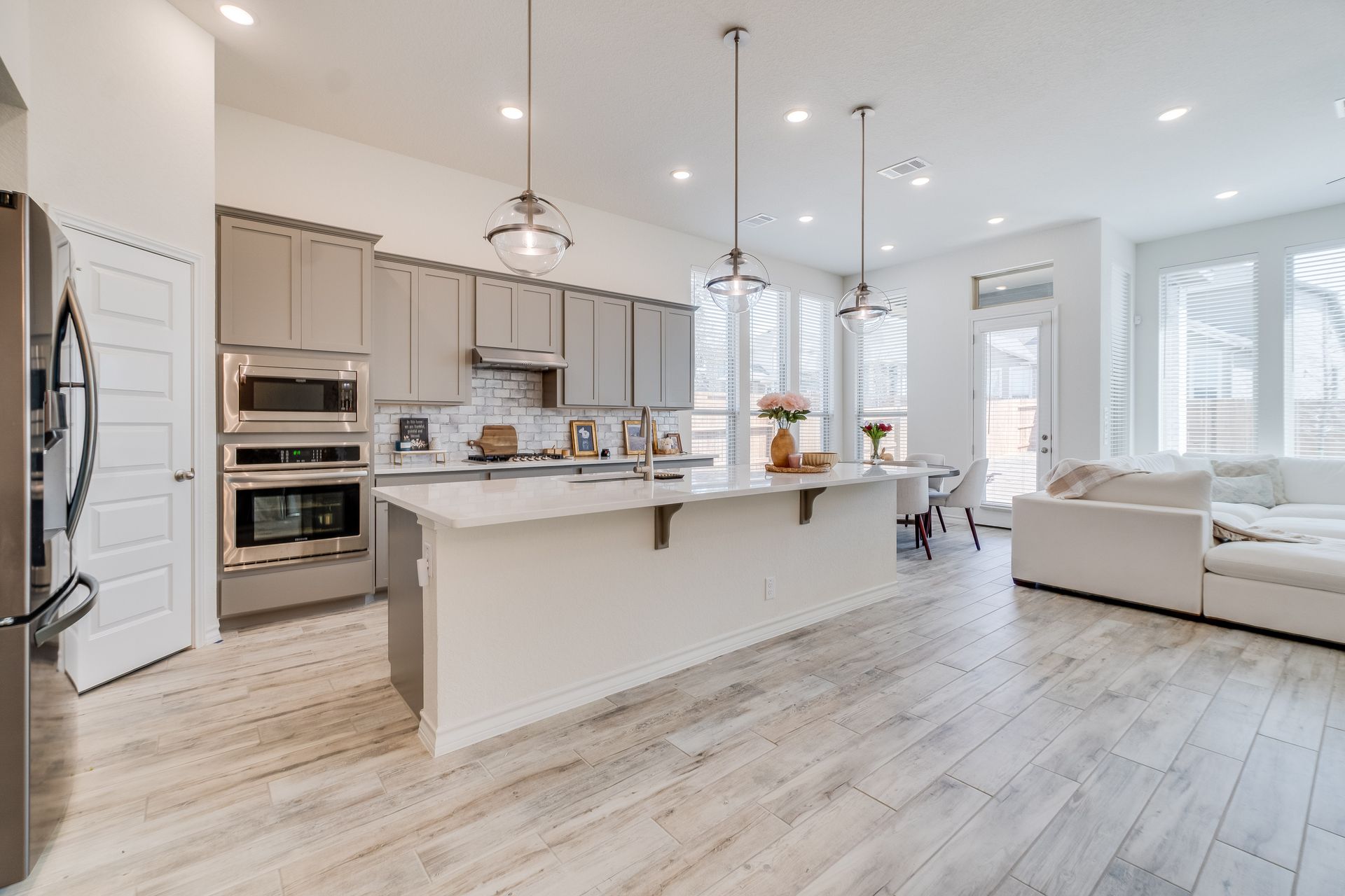 Large kitchen remodel with white cabinets and hardwood floors for style and functionality.