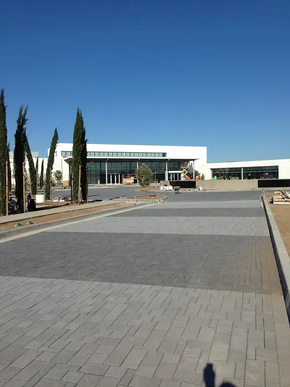 Claddagh Paving Corporation - a large building with a lot of windows and trees in front of it