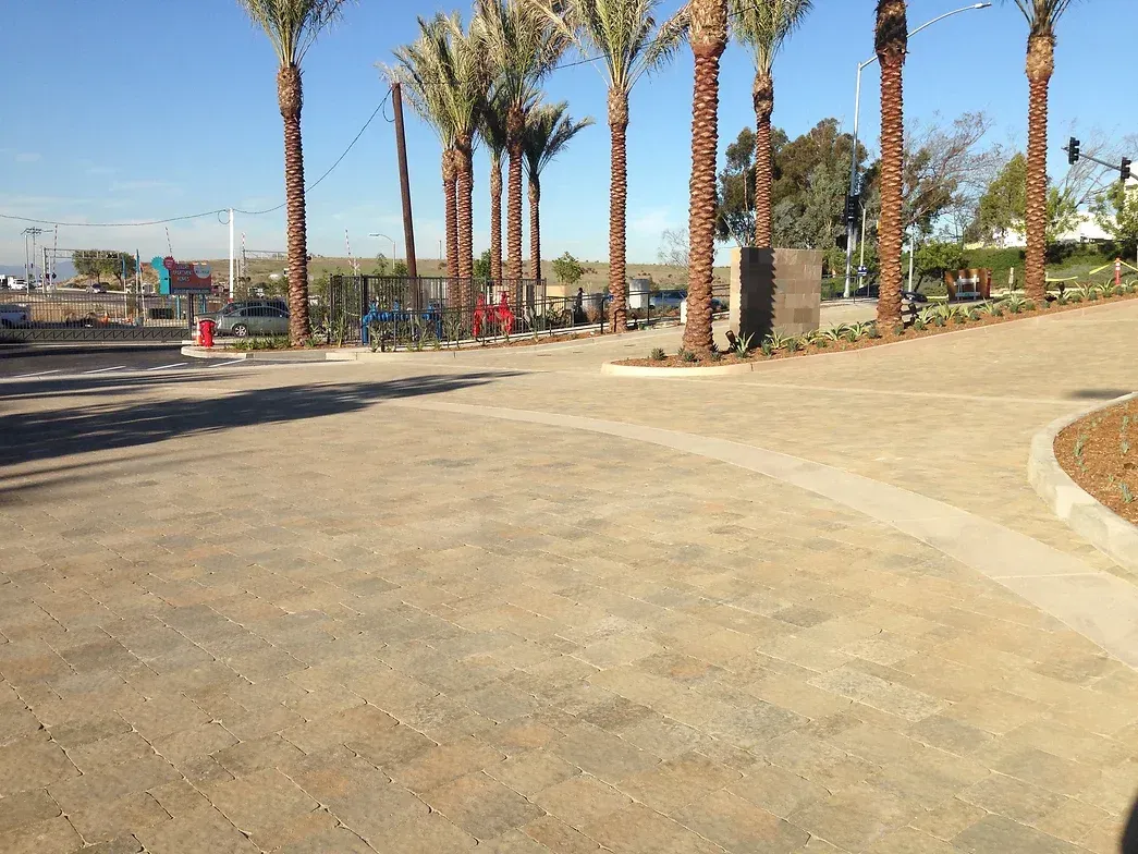 Claddagh Paving Corporation - a parking lot with palm trees in the background
