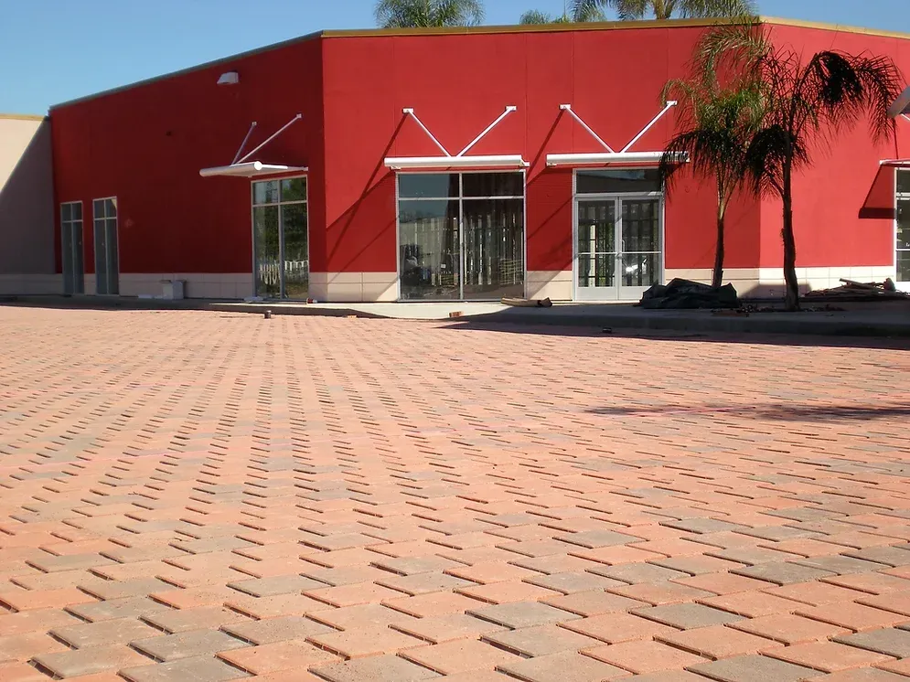 Claddagh Paving Corporation - a red building with a brick driveway in front of it