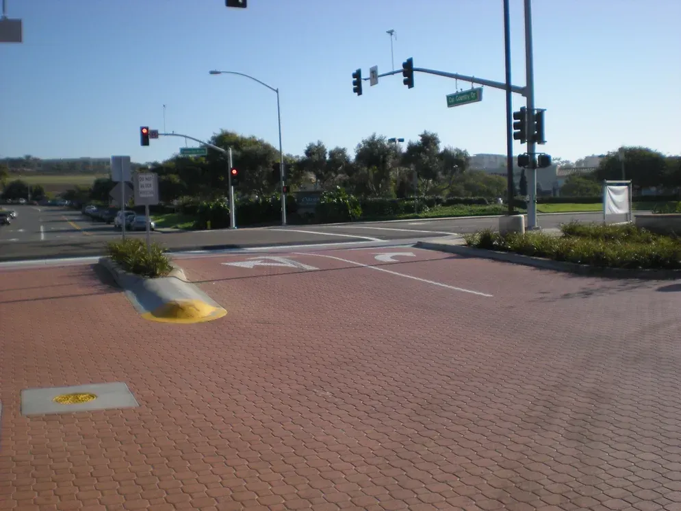 Claddagh Paving Corporation - a brick intersection with a sign that says no parking