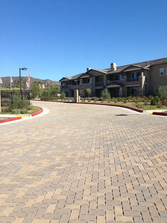Claddagh Paving Corporation - a brick road with a building in the background