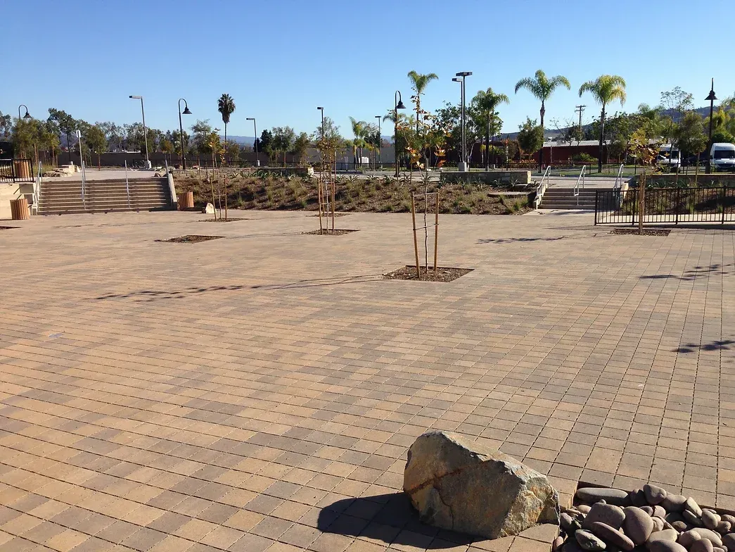Claddagh Paving Corporation - a large rock sits in the middle of a park