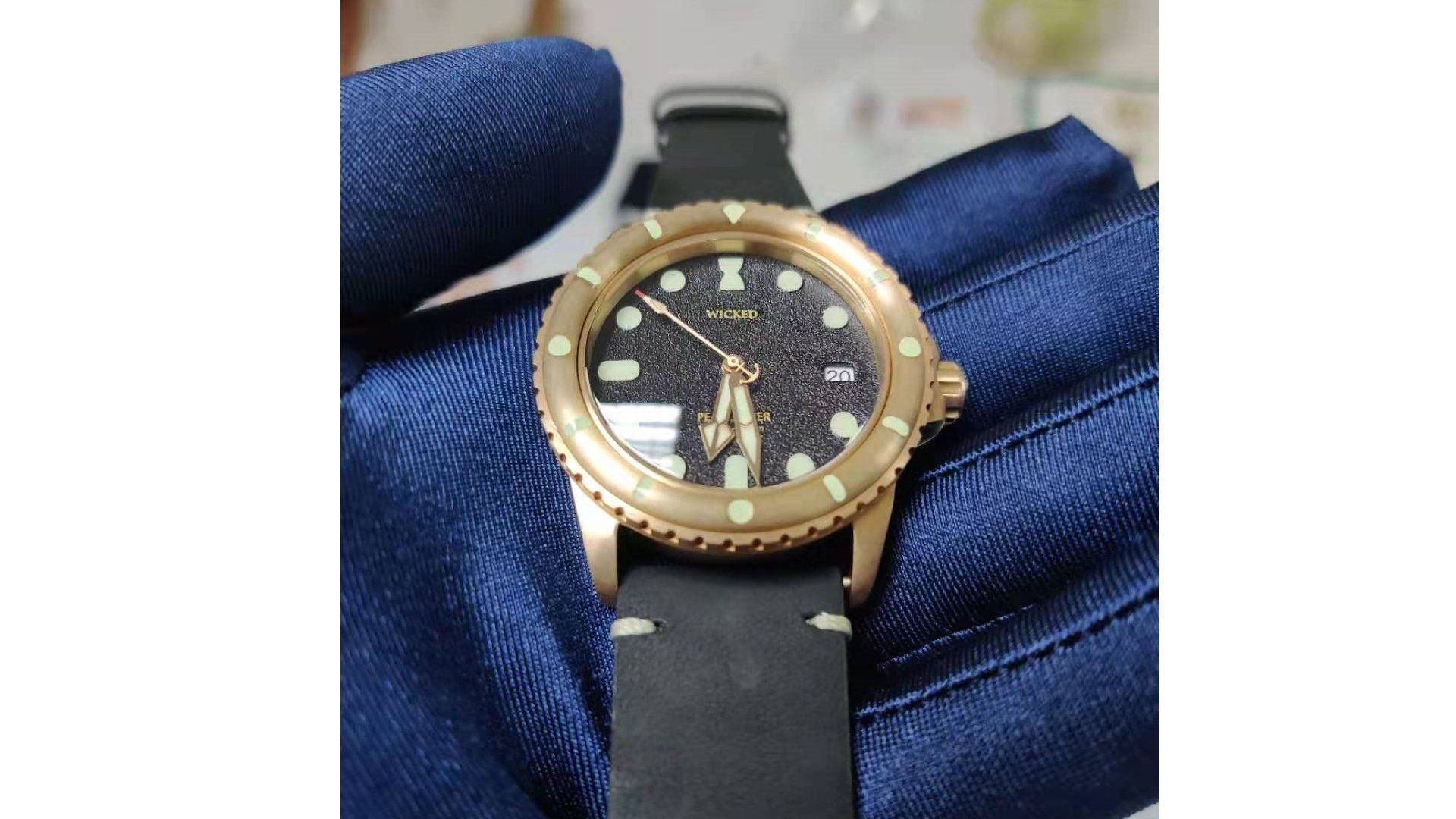 A person is holding a watch in their hand.