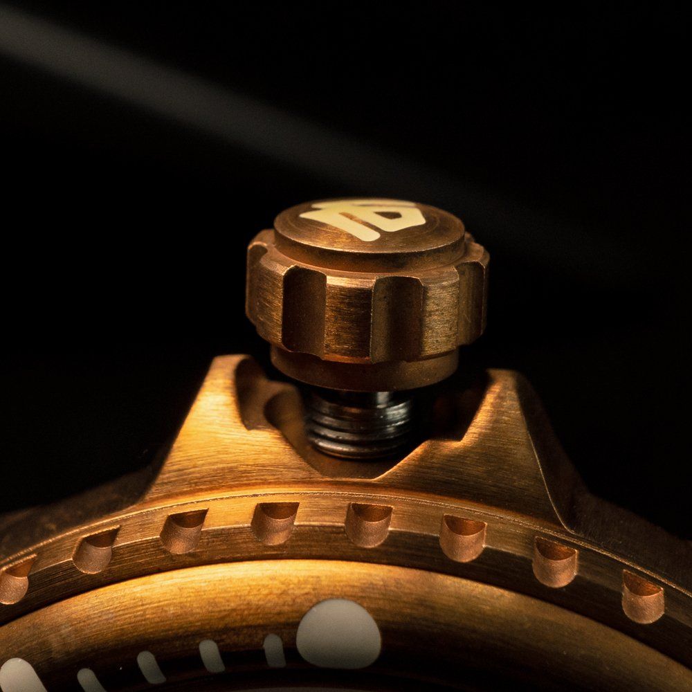 A close up of a watch face with the number 10 on it