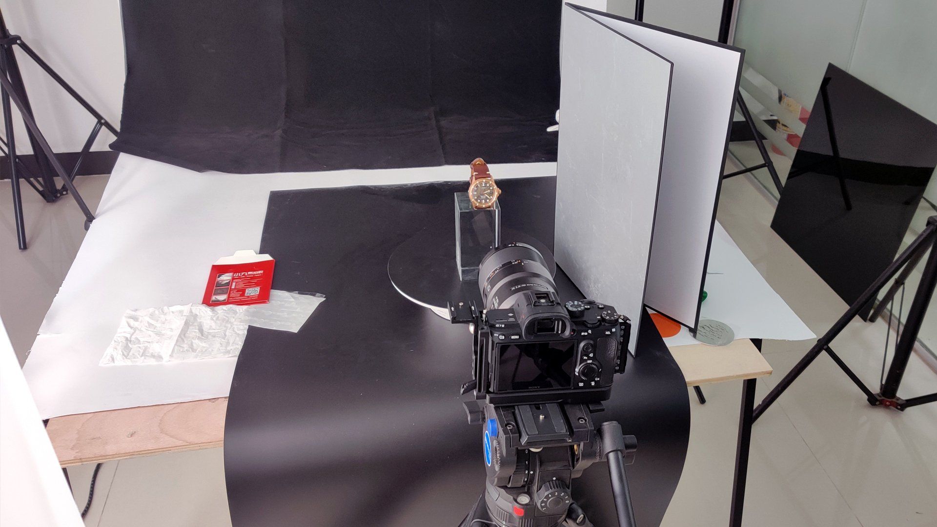 A camera is sitting on a table in a photo studio