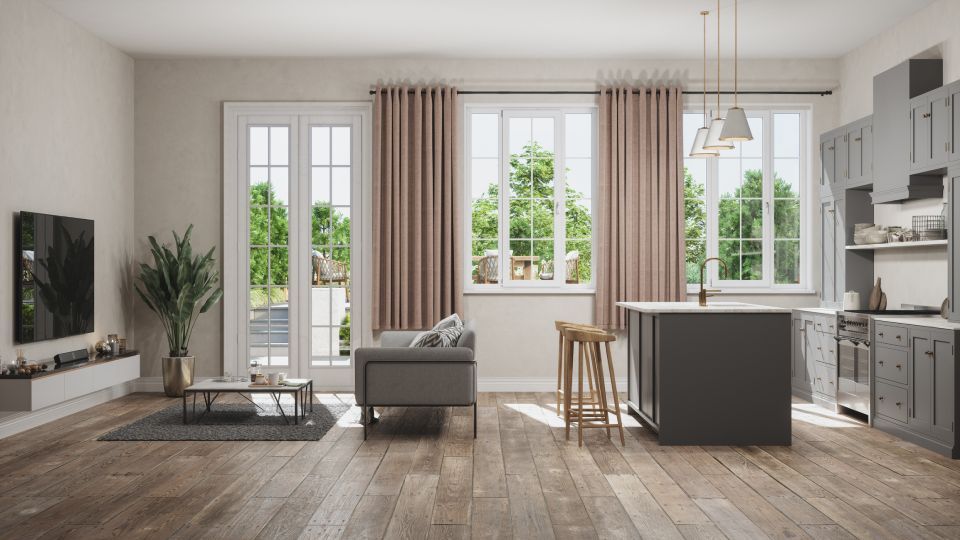 open space con mobili grigi e tende rosa antico