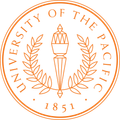 University of the Pacific seal: Torch flanked by laurel branches, encircled by text and the year 1851.
