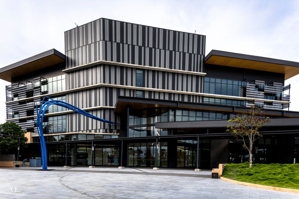 A Large Building With a Blue Sculpture in Front of It — Sell Any Car Fast in North Lakes, QLD
