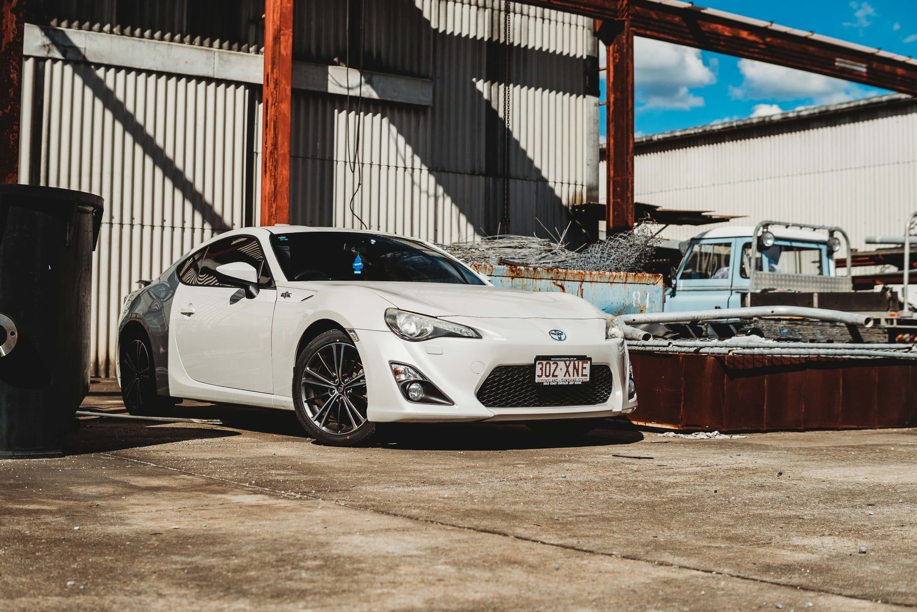 A Toyota 86 parked near a factory - Sell My Car