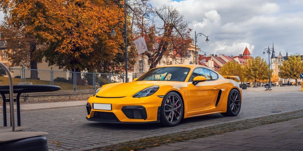 A Yellow Sports Car Is Parked on The Side of The Road — Sell Any Car Fast in Sunshine Coast, QLD