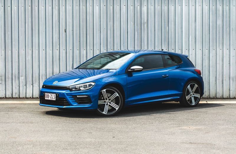 A blue Volkswagen Scirocco parked at Sell Any Car Fast