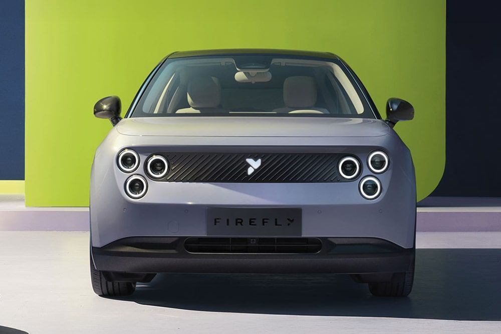 A Firefly Electric Car Is Parked in Front of A Green Wall — Sell Any Car Fast in Eagle Farm, QLD