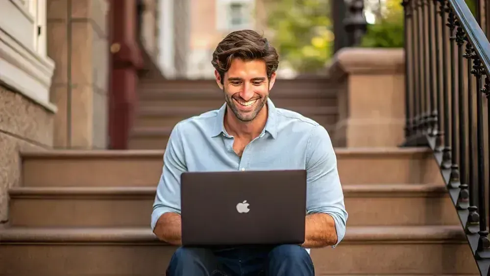 A Man Is Sitting on A Set of Stairs — Sell Any Car Fast in Eagle Farm, QLD
