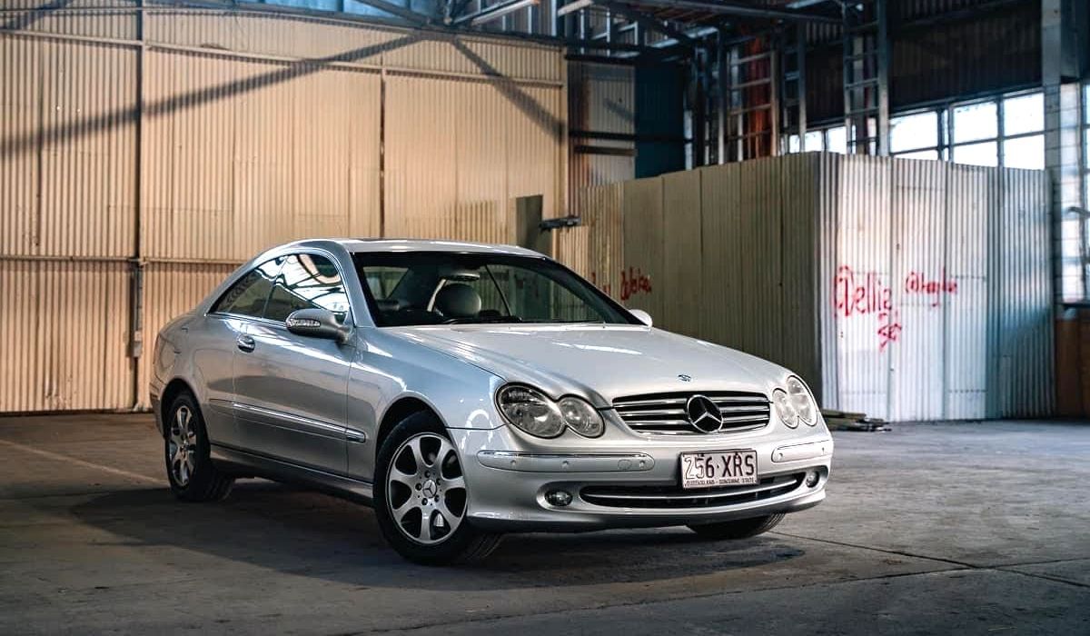 A 2004 Mercedes Benz CLK230 parked in a warehouse roadworthy certificate - Sell Any Car Fast Can you sell a car without a rwc?