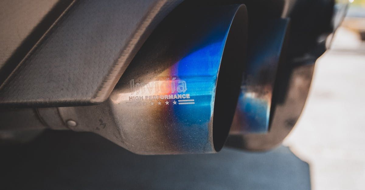 A close up of a blue exhaust pipe on a car. | Auto Tech of Tysons