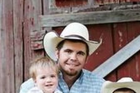 guy with cowboy hat and young boy
