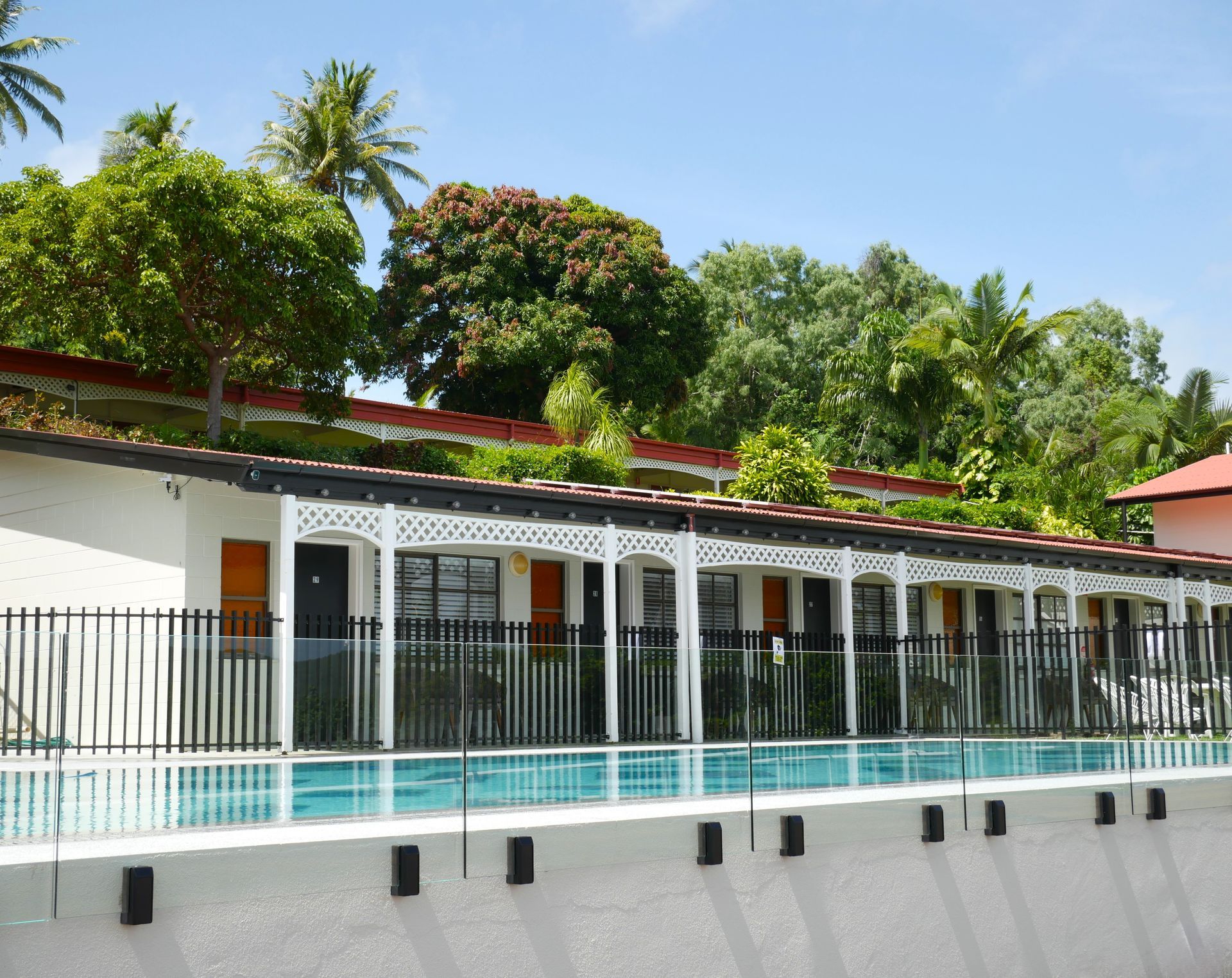 A Large Swimming Pool with A Fence Around It — Pools Plus NQ in Port Douglas, QLD 
