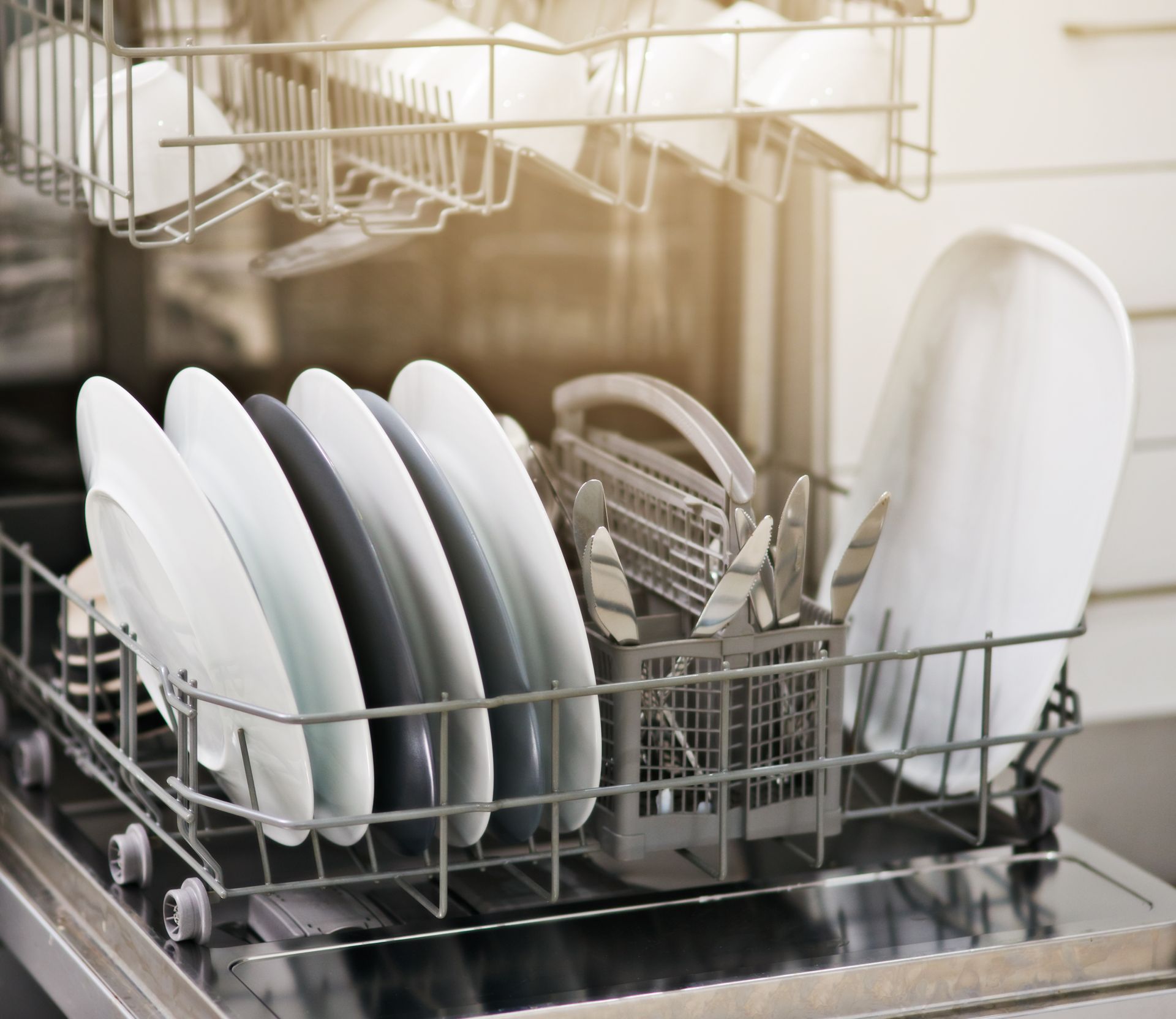 Plates and utensils inside a dishwasher | Pennsauken, NJ | H and R Appliances