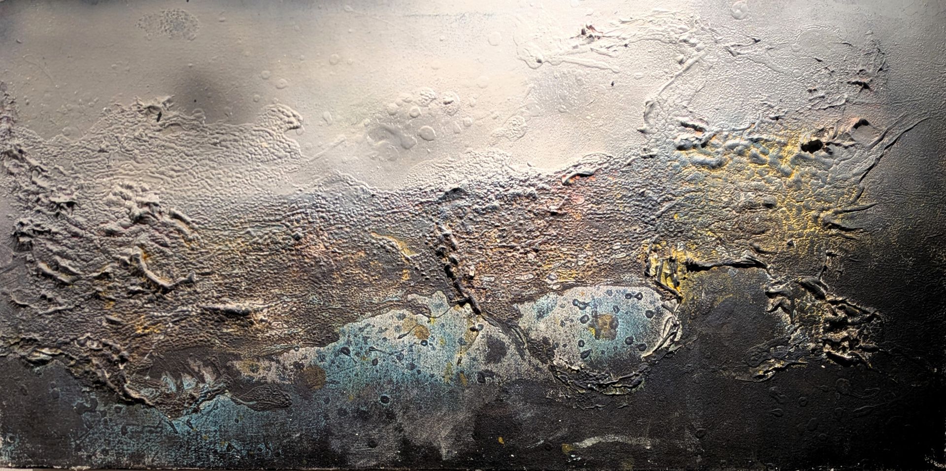Abstract textured painting in gray, beige, and blue with rough, layered surface