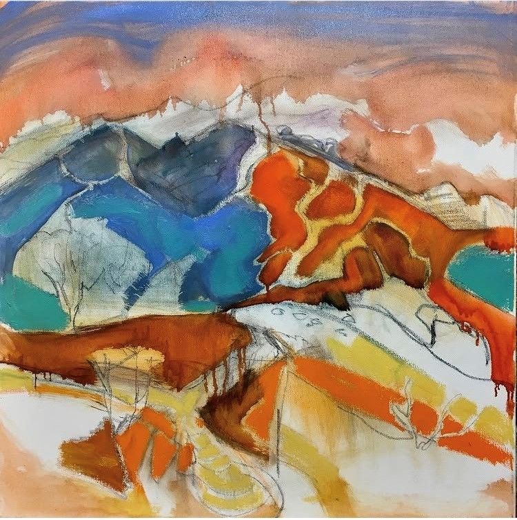Abstract watercolor landscape with blue mountains, orange hills, and a peach sky