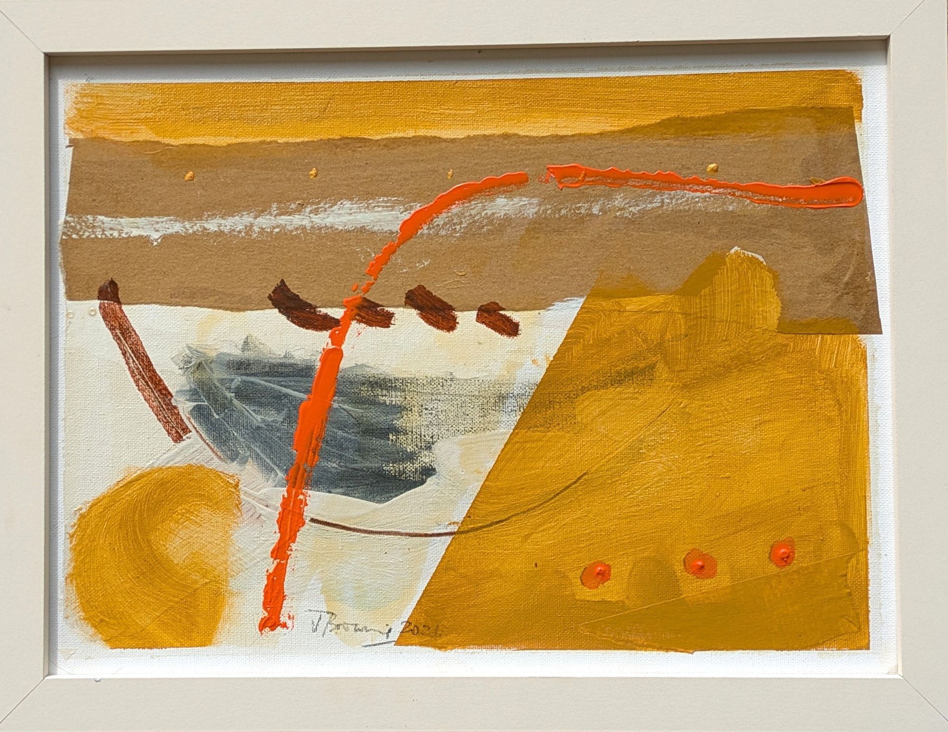 A framed painting of a yellow and brown landscape