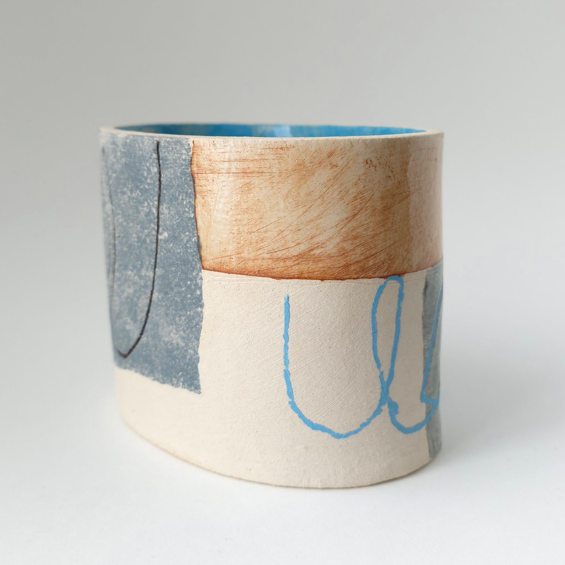 A lampshade with a black and white drawing on it